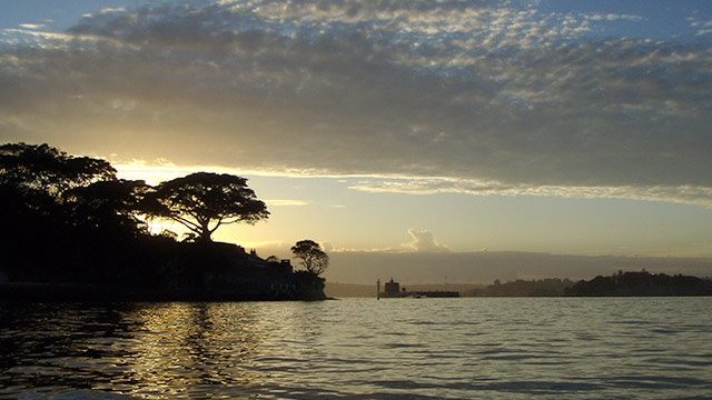 a sunset over a body of water